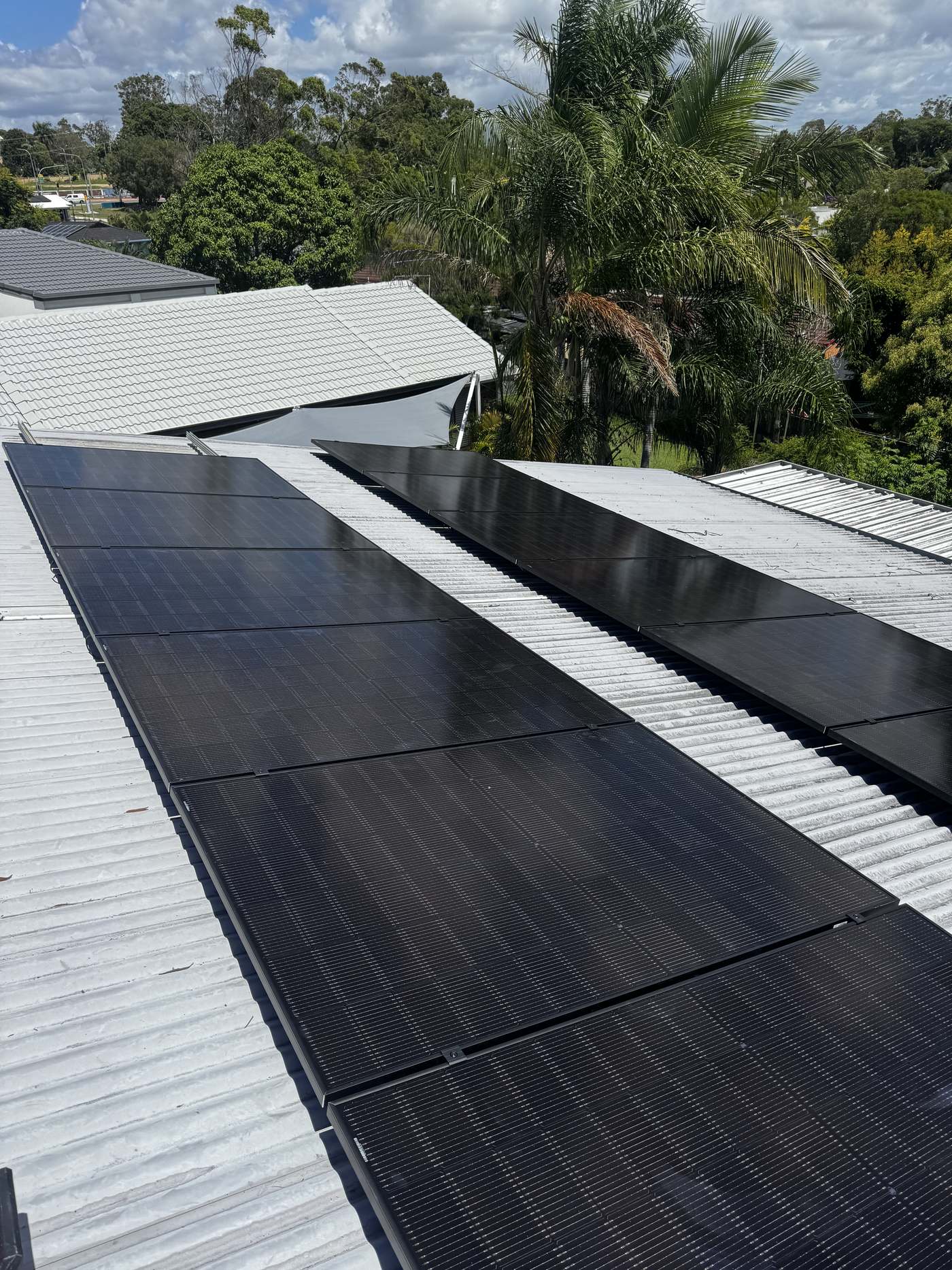 All-black solar panels installed on a metal deck roof by JPR