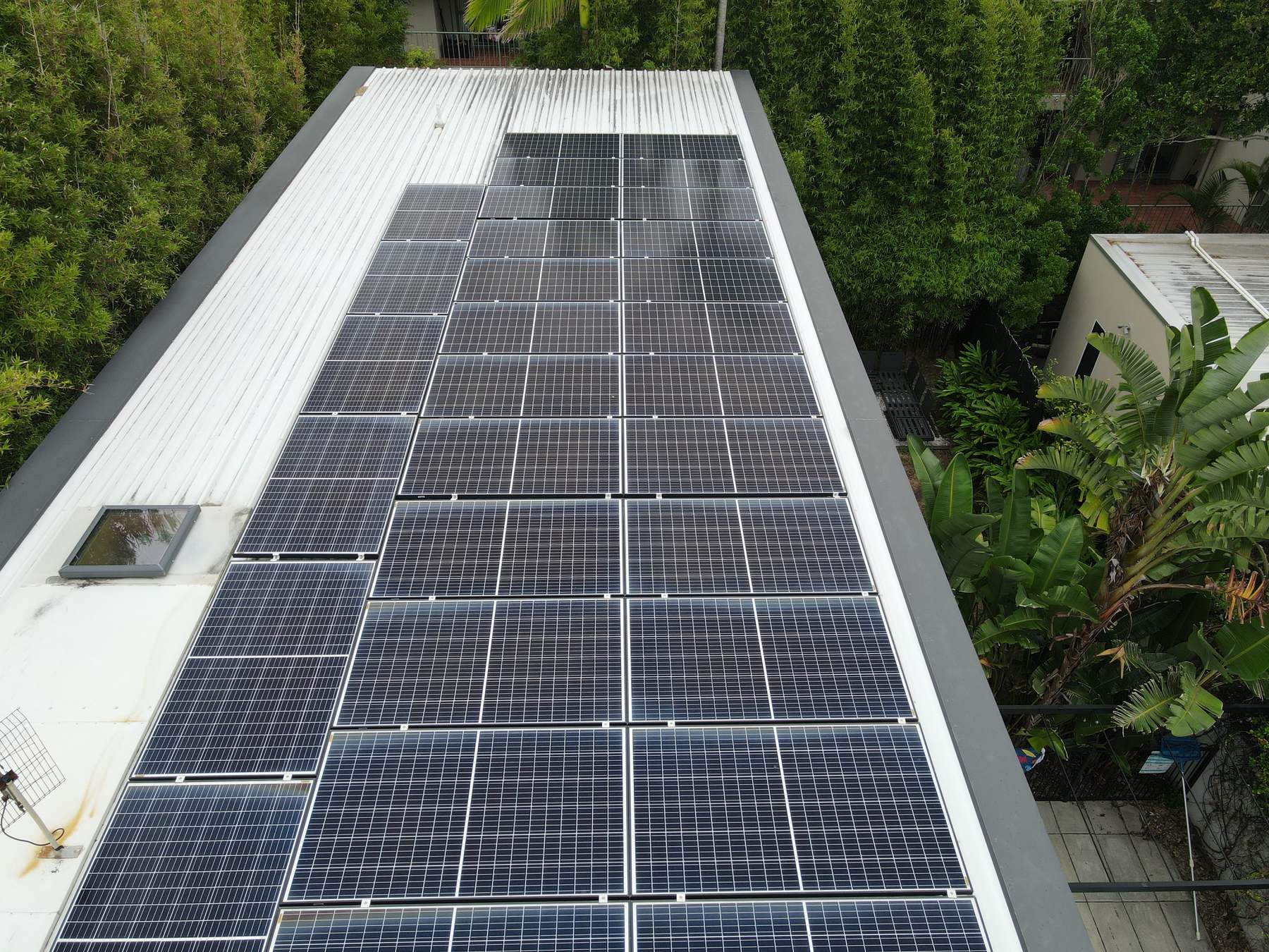 Aerial view of a rooftop solar array installed by JPR